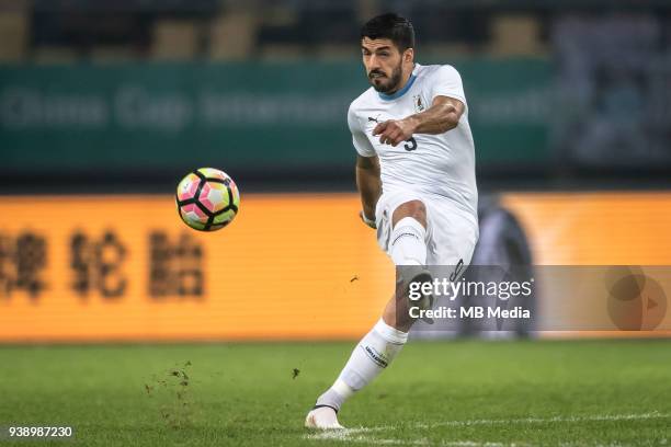 Luis Suarez of Uruguay national football team kicks the ball to make a shoot against Wales national football team in their final match during the...