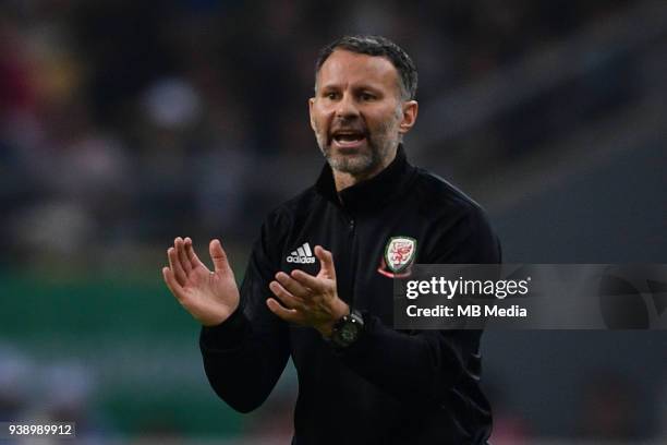 Head coach Ryan Giggs of Wales national football team shouts instructions to his players as they compete against Uruguay national football team in...