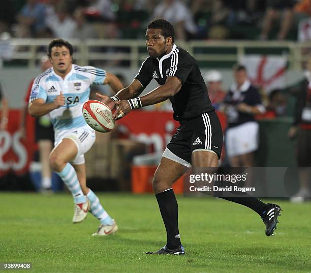 Lote Raikabula of New Zealand passes the ball against Argentina during the IRB Sevens tournament at the Dubai Sevens Stadium on December 4, 2009 in...