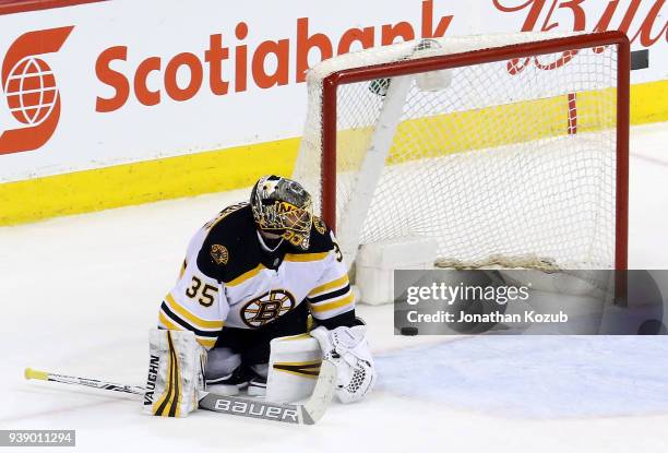 Goaltender Anton Khudobin of the Boston Bruins sits on the ice after Patrik Laine of the Winnipeg Jets scores a goal during the shootout at the Bell...