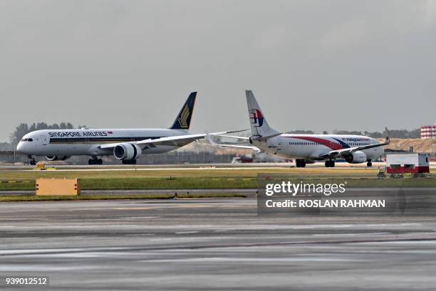 Singapore Airlines world's first Boeing 787-10 aircraft touches down upon its arrival from Boeing's production facility in North Charleston, South...