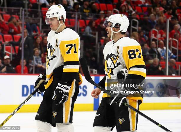 Sidney Crosby of the Pittsburgh Penguins talks to Evgeni Malkin during during the third period while playing the during the third period at Little...