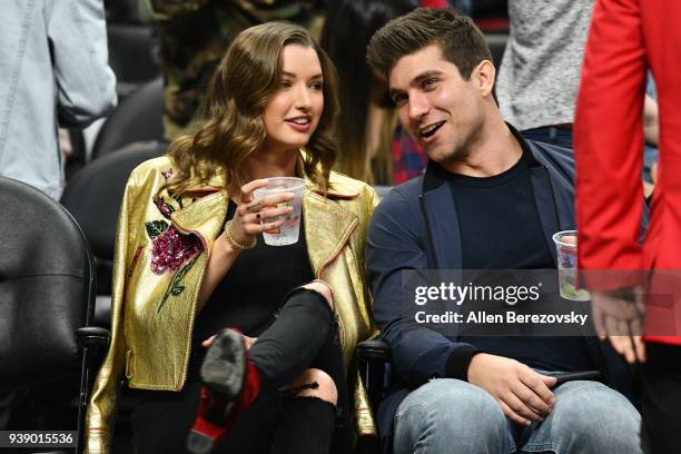 Model Alyssa Arce and a guest attend a basketball game between the Los Angeles Clippers and the Milwaukee Bucks at Staples Center on March 27, 2018...