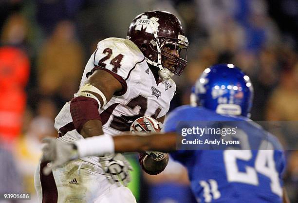 Anthony Dixon of the Mississippi State Bulldogs runs with the ball during the SEC game against the Kentucky Wildcats at Commonwealth Stadium on...