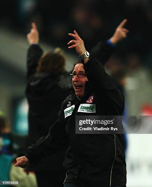 Coach Norbert Meier of Duesseldorf celebrates his team's second goal scored by Ranislav Jovanovic during the Second Bundesliga match between Fortuna...