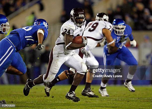 Anthony Dixon of the Mississippi State Bulldogs runs with the ball during the SEC game against the Kentucky Wildcats at Commonwealth Stadium on...