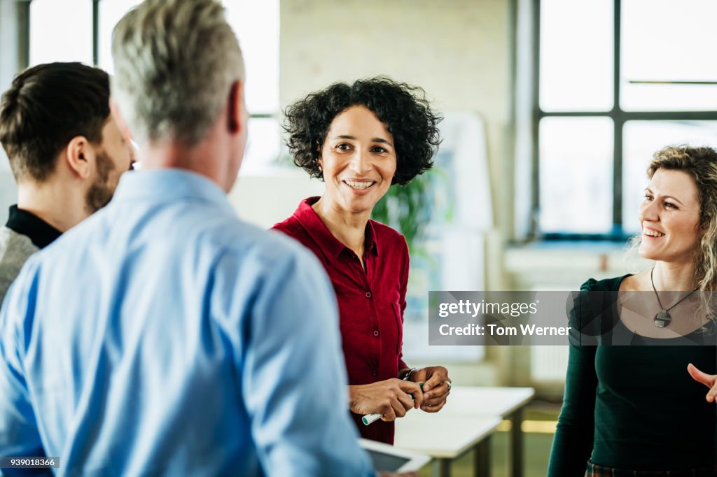 Business Colleagues Having Meeting Together At Office