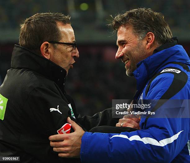 Coach Norbert Meier of Duesseldorf and coach Thomas Gerstner of Bielefeld greet each other ahead the Second Bundesliga match between Fortuna...