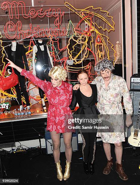 Noel Fielding and Julian Barratt of The Mighty Boosh pose with Stella McCartney after turning on the Christmas Lights at the Stella McCartney store...