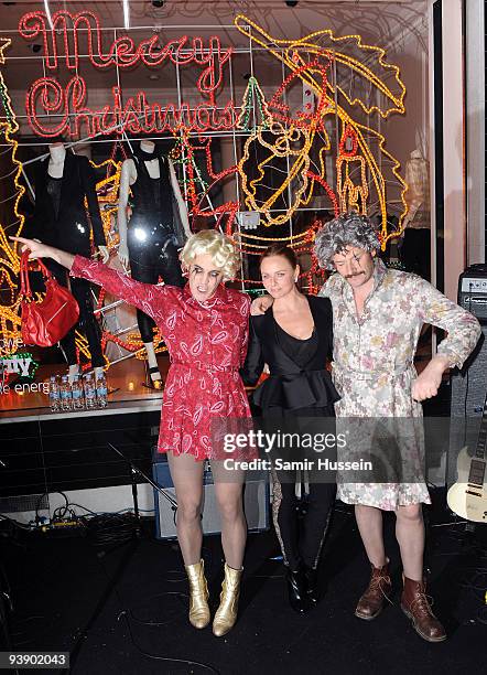 Noel Fielding and Julian Barratt of The Mighty Boosh pose with Stella McCartney after turning on the Christmas Lights at the Stella McCartney store...