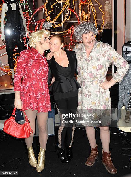 Noel Fielding and Julian Barratt of The Mighty Boosh pose with Stella McCartney after turning on the Christmas Lights at the Stella McCartney store...