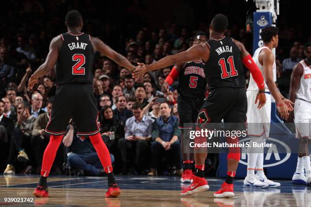 Jerian Grant and David Nwaba of the Chicago Bulls high five during the game against the New York Knicks on March 19, 2018 at Madison Square Garden in...