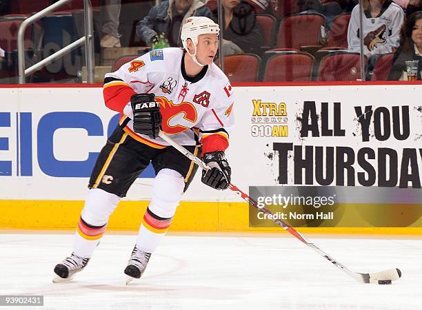 Jay Bouwmeester of the Calgary Flames skates up ice with the puck against the Phoenix Coyotes on December 3, 2009 at Jobing.com Arena in Glendale,...