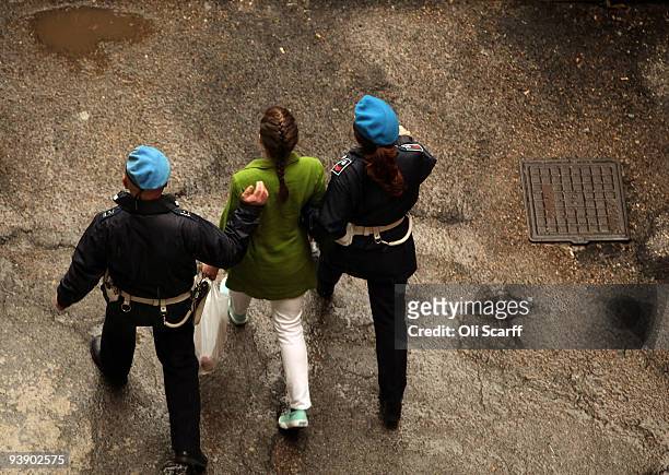 Defendant Amanda Knox is escorted away from court at the end of the final day of the Meredith Kercher murder trial on December 4, 2009 in Perugia,...