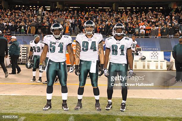 Linebacker Joe Mays, defensive end Jason Babin and wide receiver Jason Avant of the Philadelphia Eagles pose for a photo during the game against the...