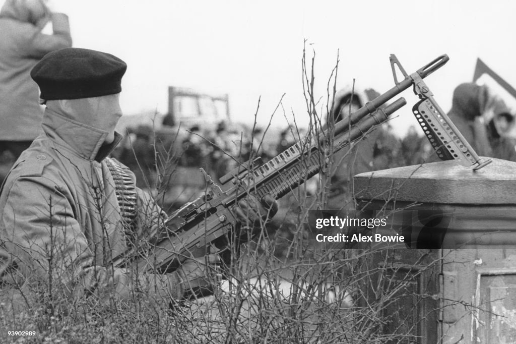 Ira With Rifles An IRA gunman holds a US-made M60 machine gun and wears a stocking as ...