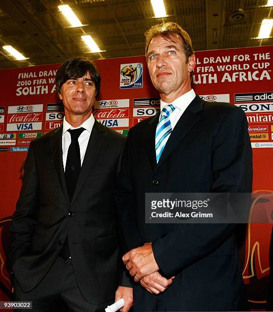 German coach Joachim Loew stands with Australian coach Pim Verbeek after the Final Draw for the FIFA World Cup 2010 December 4, 2009 at the...