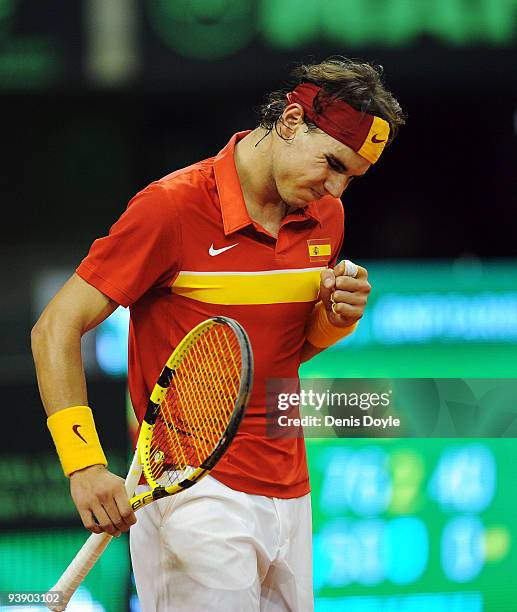 Rafael Nadal of Spain celebrates after winning a point against Tomas Berdych of Czech Republic during the first match of the Davis Cup final at the...