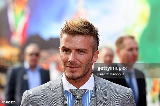 In this handout photo provided by the 2010 FIFA World Cup Organising Committee, David Beckham speaks to journalists and fans sttends the Red Carpet...