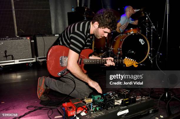 Peter Silberman performs on stage at Sala Apolo on December 2, 2009 in Barcelona, Spain. He plays a Fender Mustang guitar and kneels on the stage...