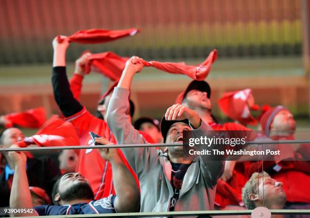 Nationals fans react as the Nationals take the field at the beginning of the game as the Washington Nationals play the Los Angeles Dodgers in game 5...