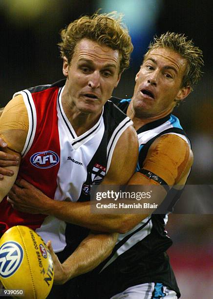 Matthew Capuano for St Kilda is tackled by Jarrad Schofield for Port Adelaide, during the Round 3 AFL Match between the St Kilda Saints and the Port...