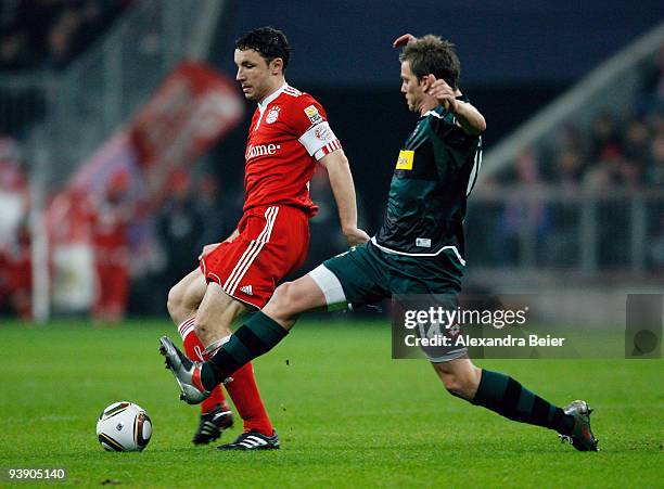 Marc van Bommel of Bayern Muenchen fights for the ball with Thorben Marx of Borussia M'gladbach during the Bundesliga match between FC Bayern...