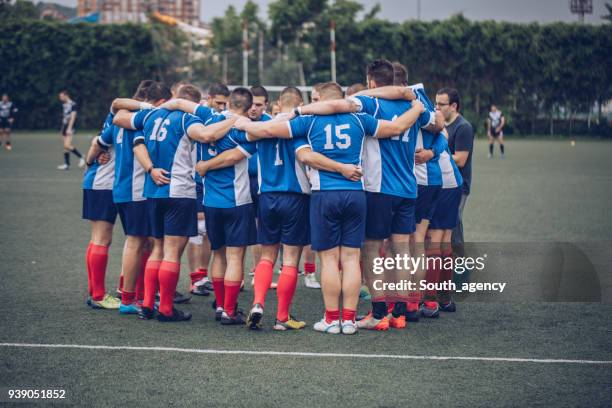 rugby players huddling - scrum stock pictures, royalty-free photos & images