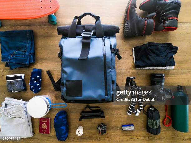 packing the backpack getting ready to going for a travel. - camera bag stockfoto's en -beelden