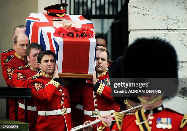 The coffin of Darren Chant, Regimental Sergeant Major, 1st Battalion Grenadier Guards, is carried out of the Royal Military Chapel at Wellington...