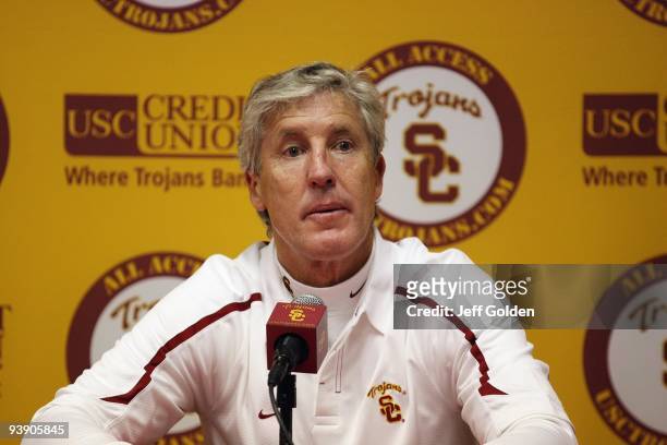 Head coach Pete Carroll of the USC Trojans listens to a question from a member of the media at a post game press conference following the game...
