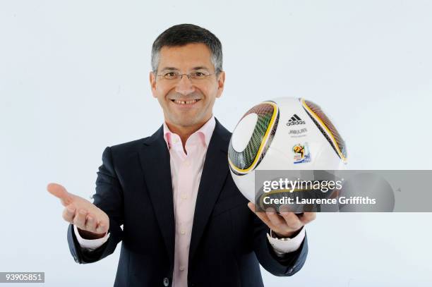 Adidas Chief Executive Herbert Hainer presents the official match ball for the FIFA World Cup 2010 on December 4, 2009 in Cape Town, South Africa.