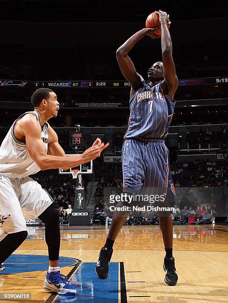 DeSagana Diop of the Charlotte Bobcats shoots against JaVale McGee of the Washington Wizards during the game on November 28, 2009 at the Verizon...