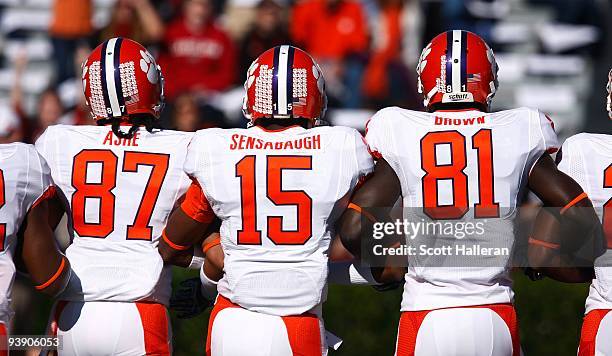 Terrance Ashe, Coty Sensabaugh and Jaron Brown of the Clemson Tigers walk across the field prior to the start of the game against the South Carolina...