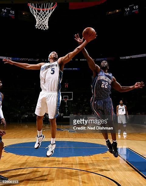 Dominic McGuire of the Washington Wizards goes for the rebound against Ronald Murray of the Charlotte Bobcats during the game on November 28, 2009 at...
