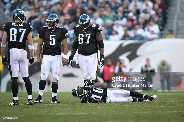 Wide receiver DeSean Jackson of the Philadelphia Eagles lies on the field after suffering a concussion as tight end Brent Celek, quarterback Donovan...