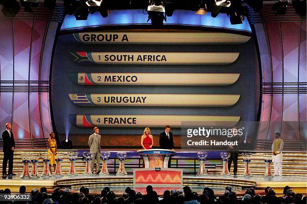 In this handout photo provided by the 2010 FIFA World Cup Organising Committee, Group A, showing South Africa, Mexico, Uruguay and France, during the...