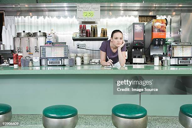 bored waitress in a diner - seulement des adultes photos et images de collection