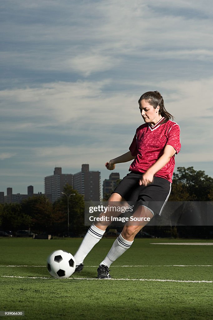 Woman playing football