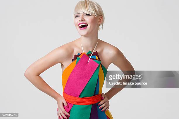 young woman in dress made of coloured ribbons - color stockfoto's en -beelden