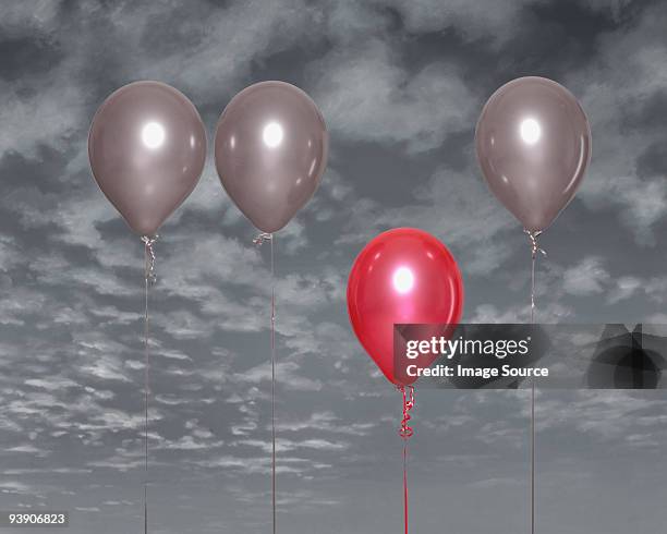 red balloon standing out - red balloon stock pictures, royalty-free photos & images