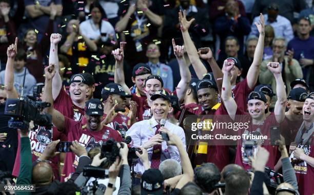 Loyola head coach Porter Moser addresses fans as the team celebrates after a 78-62 win against Kansas State in an NCAA Tournament regional final at...