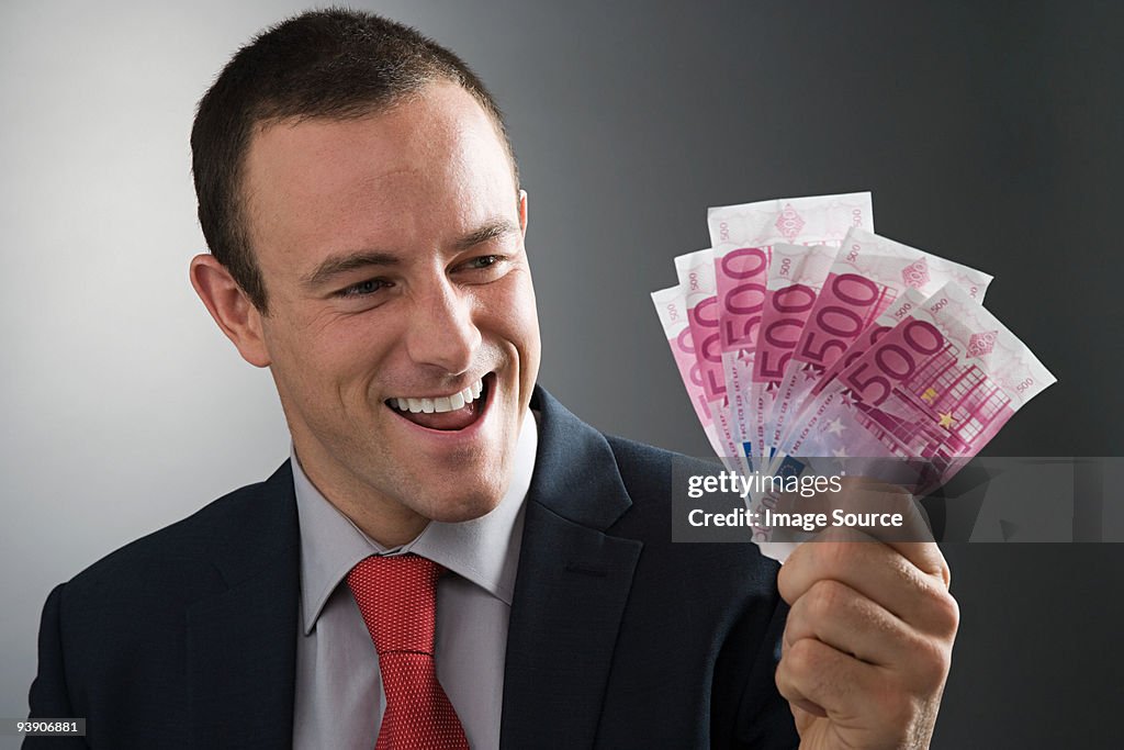 Businessman holding bank notes