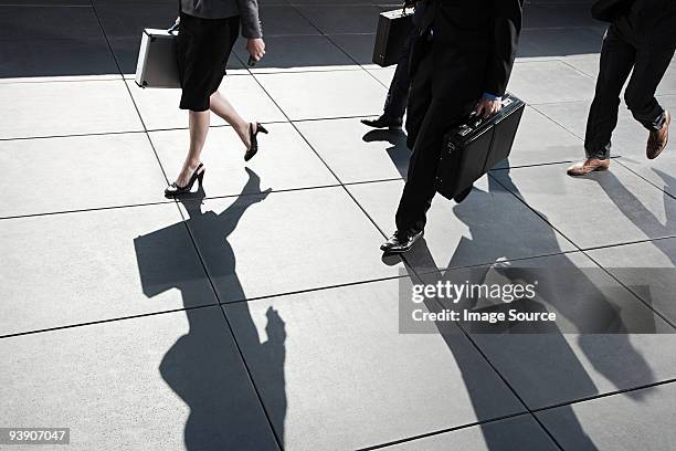businesspeople walking - businesswoman nyc stock pictures, royalty-free photos & images