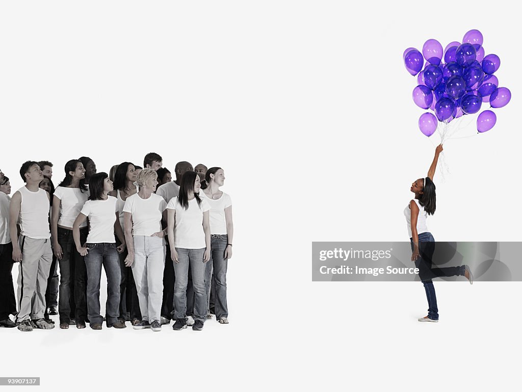 Woman holding balloons