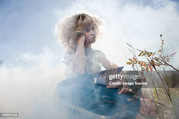 girl with a suitcase and ticket - dry ice fog stock pictures, royalty-free photos & images