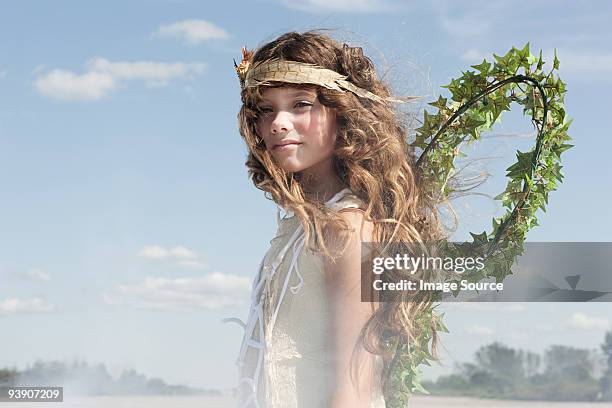 girl dressed as a fairy - angel dust stockfoto's en -beelden
