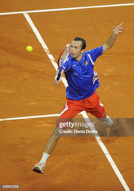 Radek Stepanek of Czech Republic returns a shot to David Ferrer of Spain during the second match of the Davis Cup final at the Palau Sant Jordi...