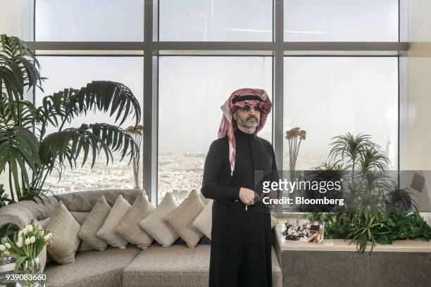 Prince Alwaleed Bin Talal, Saudi billionaire and founder of Kingdom Holding Co., poses for a photograph in the penthouse office of Kingdom Holding...