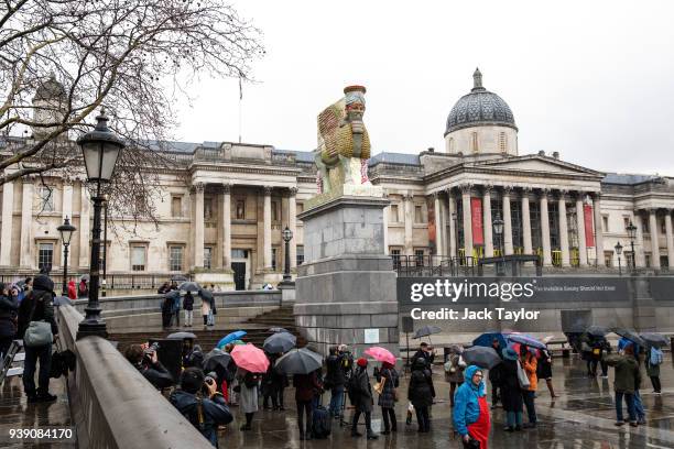 The new fourth plinth sculpture titled 'The Invisible Enemy Should Not Exist' by Iraqi American artist Michael Rakowitz is unveiled in Trafalgar...